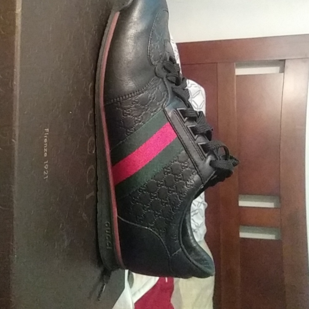 Black leather webbed Gucci sneakers